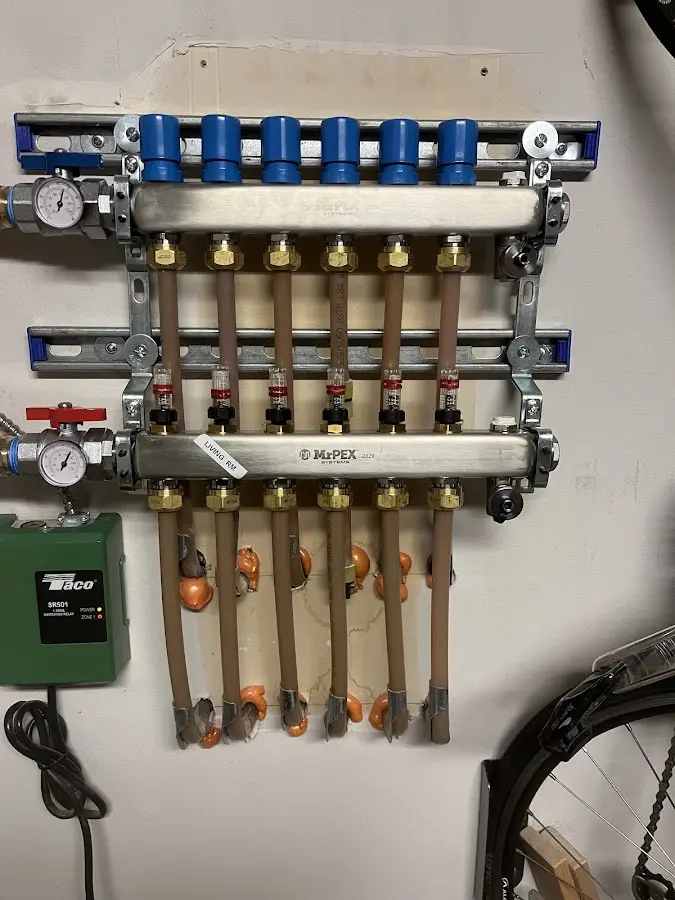 Plumber performing Water Heater Repair at a residential property in Five Corners